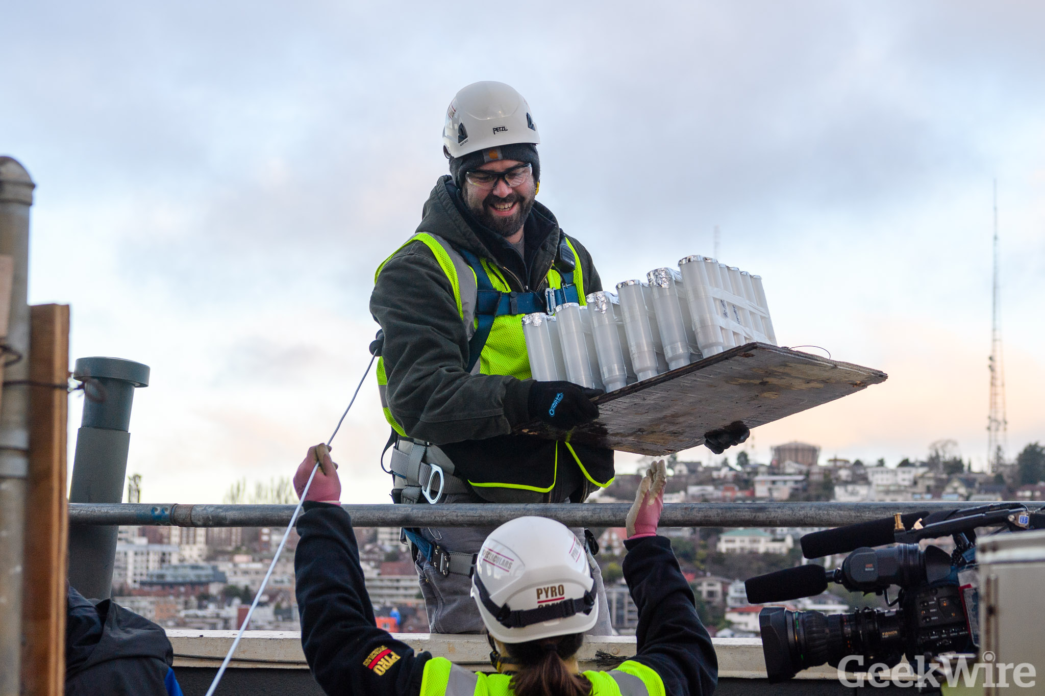 Watch workers scale the Space Needle, transform Seattle landmark for ...