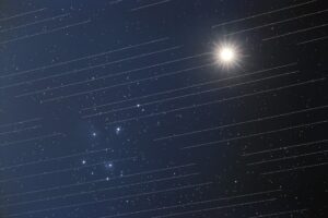 Starlink satellites with Venus and the Pleiades