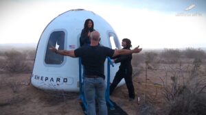 Jeff Bezos greets Lauren Sanchez as she steps out of New Shepard crew capsule