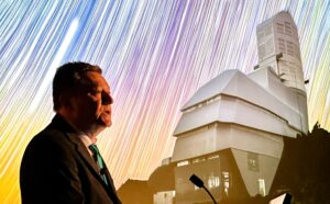 UW astronomer Zeljko Ivezic with picture of Rubin Observatory