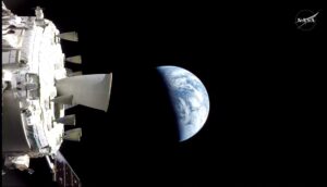 Image from Orion: Thrusters in foreground to the left, Earth in center of image
