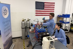 Engineers work on hardware in Interlune's Regolith Lab
