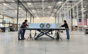 Engineers work on satellite at K2 Space factory