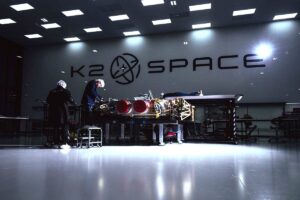 Engineers working on K2 Space's Gravitas satellite on shop floor