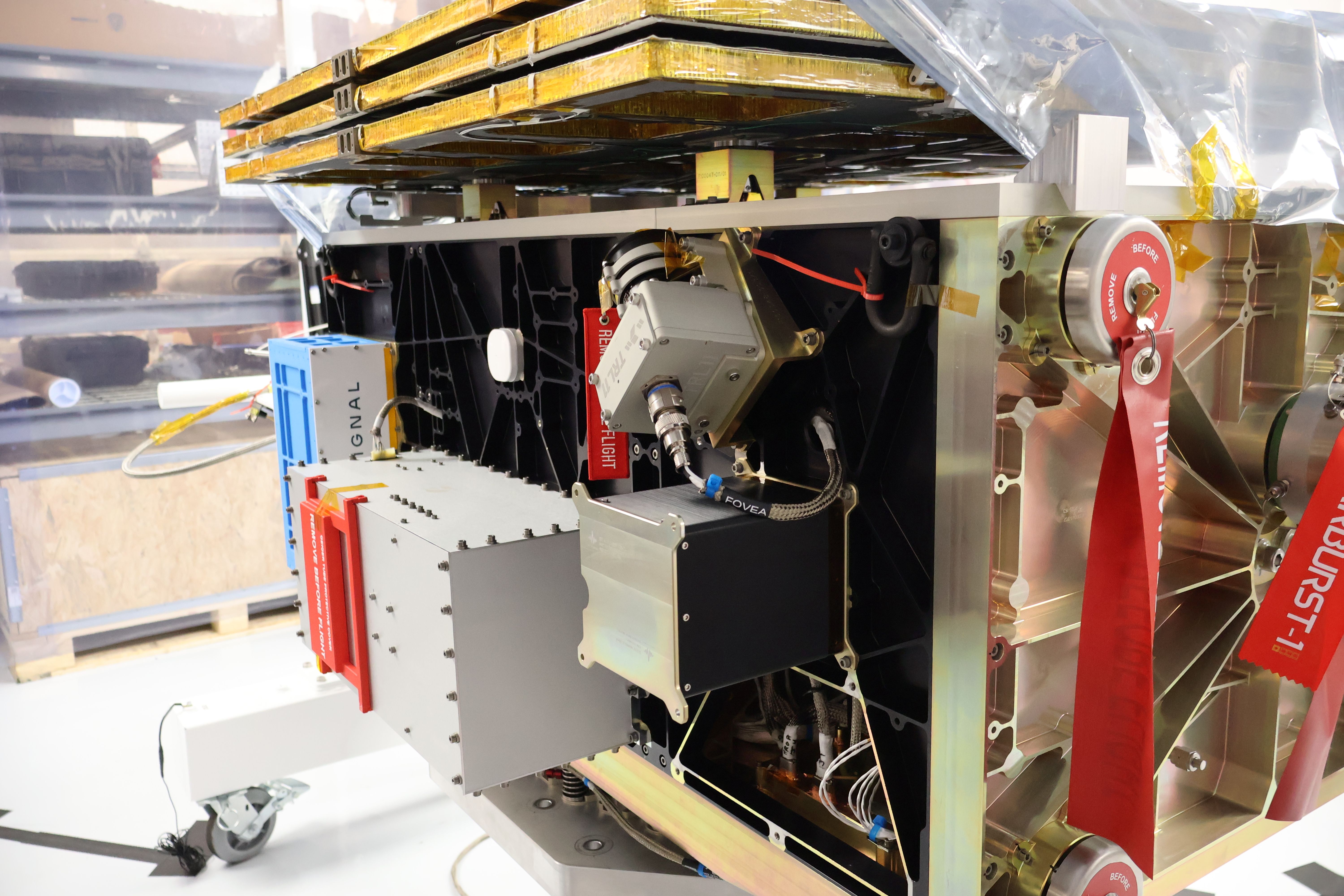 Starburst-1 satellite with payloads attached to the side