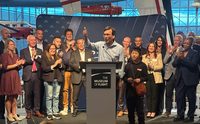Gov. Bob Ferguson surrounded by Washington Space Council members at Museum of Flight