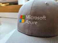 A gray baseball cap embroidered with the Microsoft logo and the words Microsoft Azure.