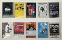 Ten framed posters for Microsoft Garage science fairs and hack days hanging in two rows on a white wall.